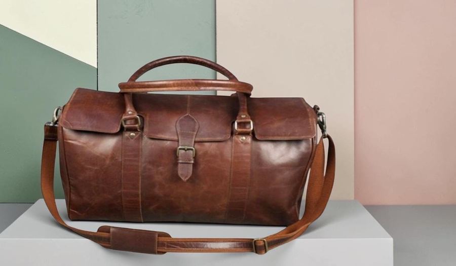 Navy leather duffel bag with pocket